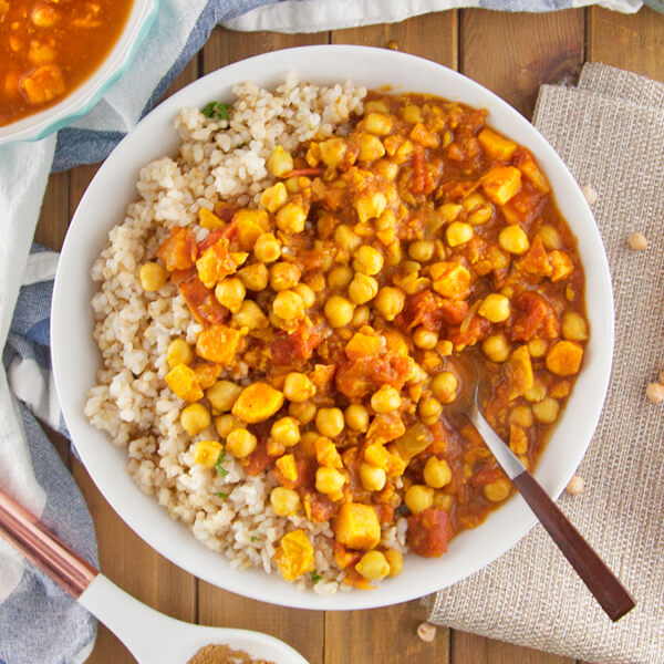 Spicy Indian Chana Masala with Sweet Potatoes Over Herbed Brown Rice-square view